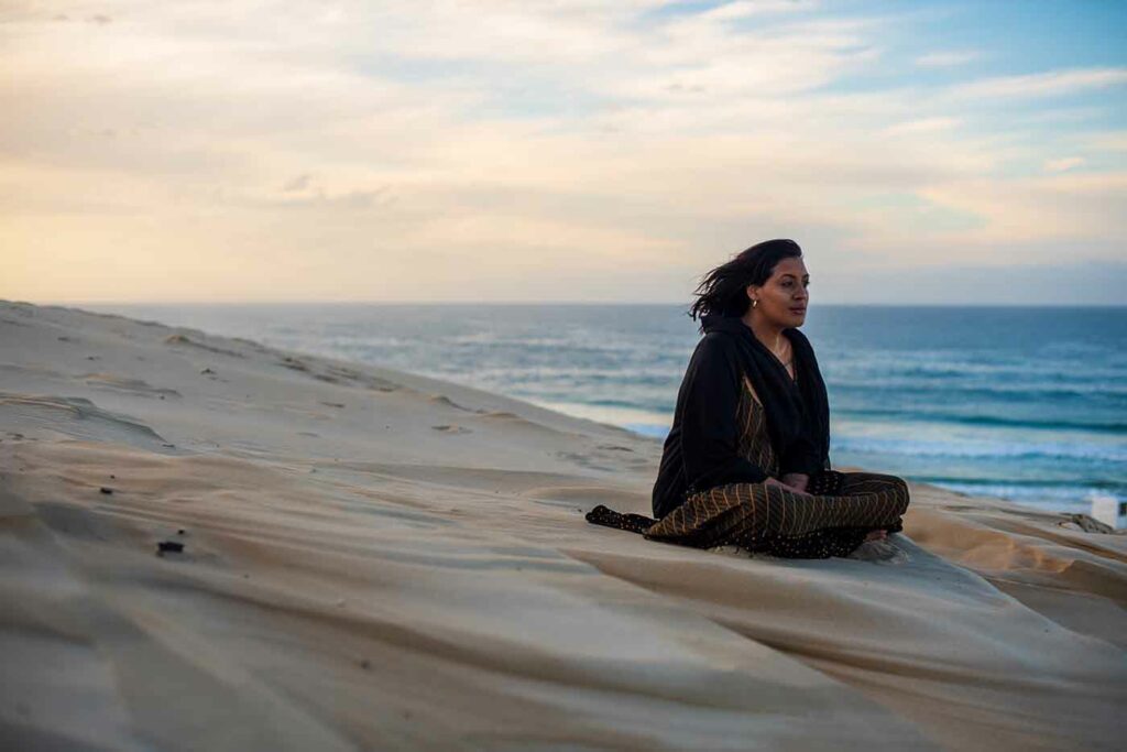 Self Care For Parents 10 Woman sitting and contemplating at the beach