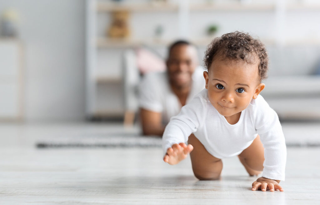 adorable black infant baby crawling away from fath 2025 03 18 19 16 29 utc