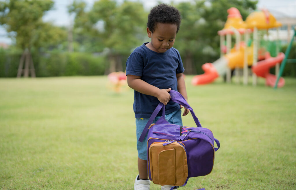 cute little boy carrying a school bag with a smili 2024 12 05 14 49 46 utc