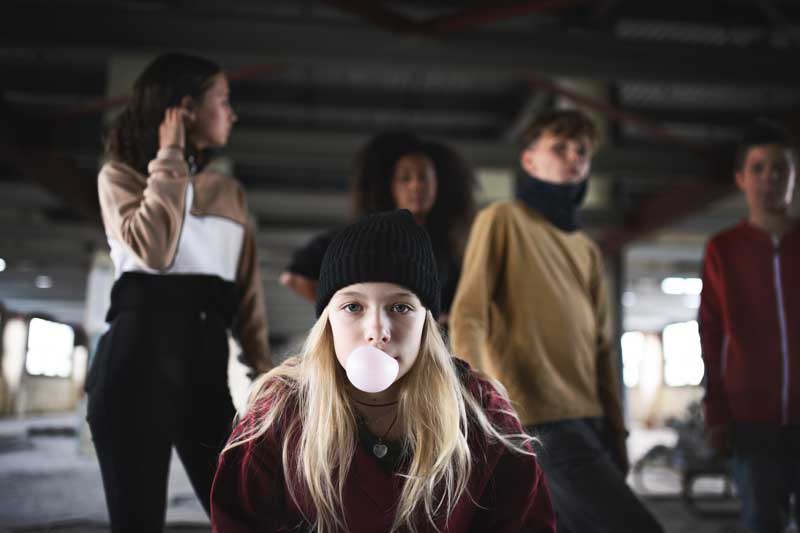 teenager girl with friends standing indoors in aba small